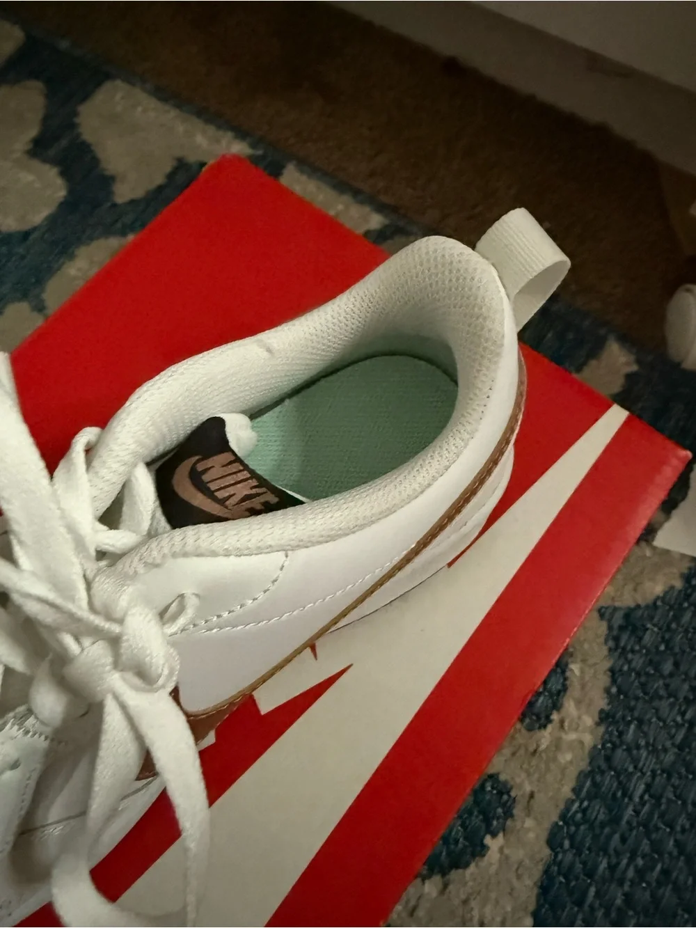 Nike Kids White Sneakers with Metallic Rose Swoosh